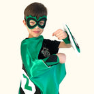 boy in positive affirmation green and black personalized superhero costume set,  dress-up costume kit - lined satin cape, shield, mask, belt, and wrist cuffs. Handmade by Creative Capes in USA to inspire imaginative play and confidence, activity for healthy childhood.