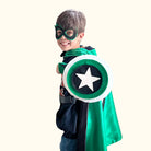 boy in green and black personalized superhero costume set, child's first initial on the super hero cape, dress-up costume kit - lined satin cape, shield, mask, belt, and wrist cuffs, handmade by Creative Capes in USA, inspire imaginative play and confidence, play without screens creates a healthy childhood