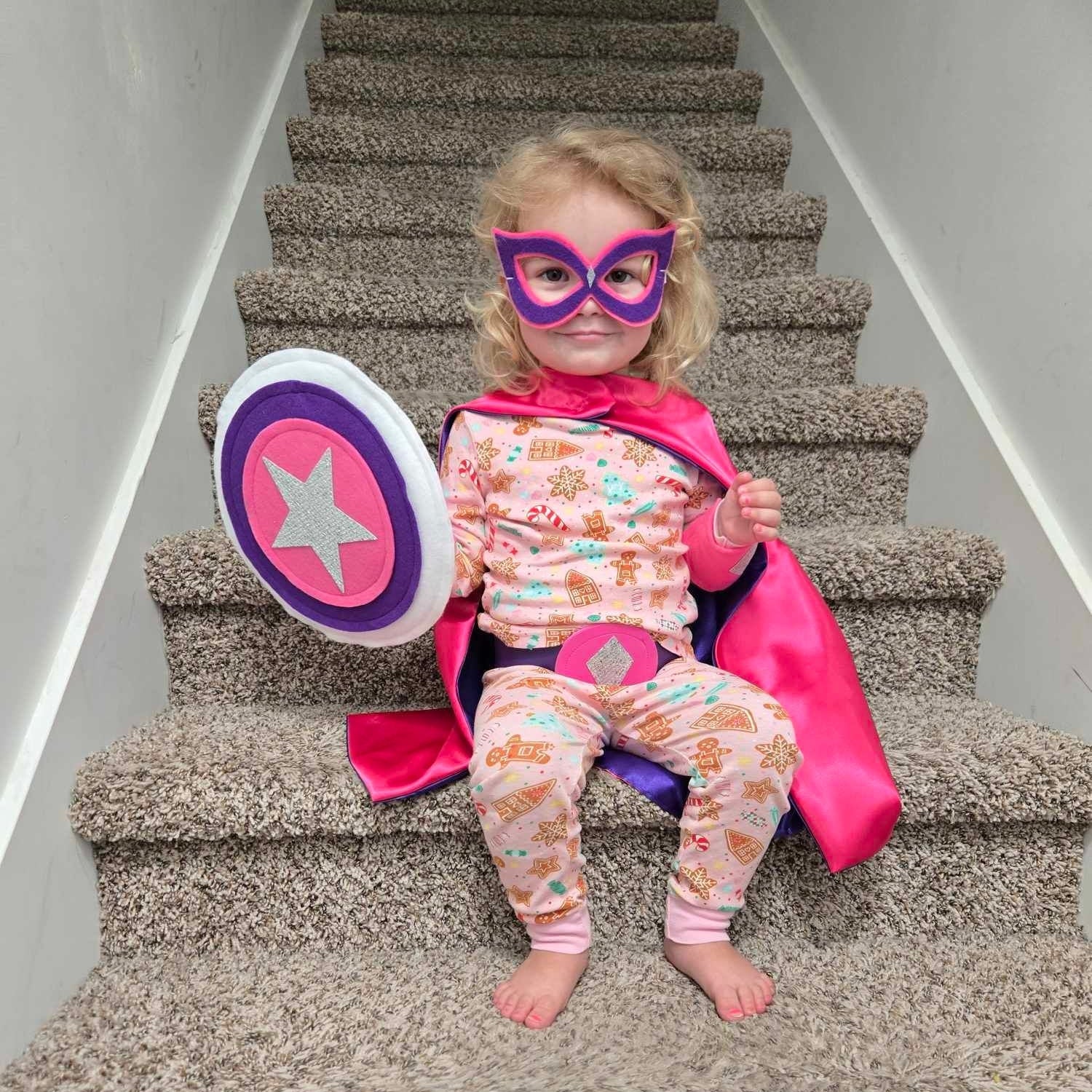 girl in pink superhero costume handmade by Creative Capes