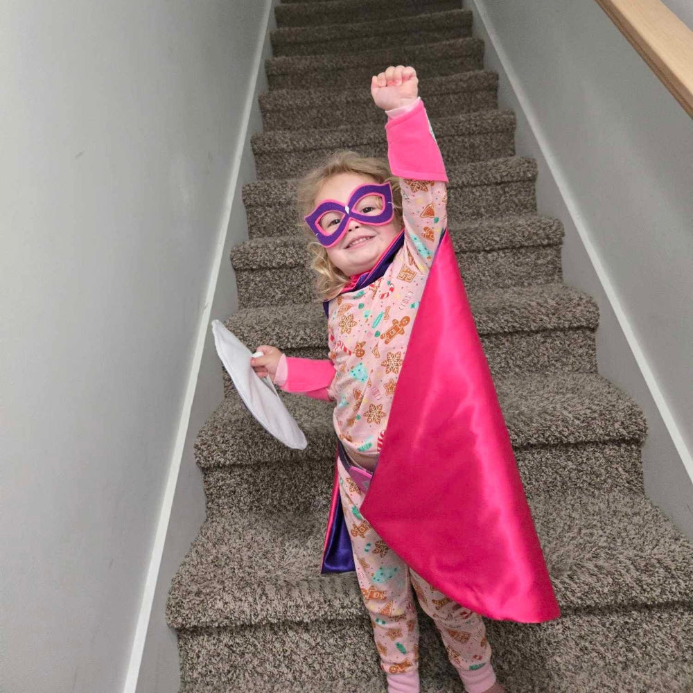 girl in pink and purple superhero costume