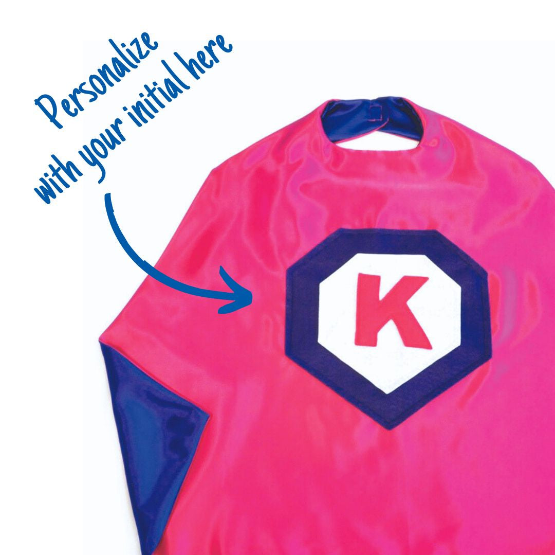 pink personalized superhero satin cape, featuring the child's first initial on the super hero cape, positive affirmation capes that allow kids to become their own super hero. Handmade by Creative Capes in USA to inspire imaginative play and confidence. Play without screens creates a healthy childhood.