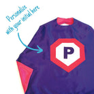 purple and pink personalized superhero cape with child's first initial,  satin lined cape, handmade by Creative Capes in USA, play activity to inspire imaginative play and confidence, healthy alternative to screen time