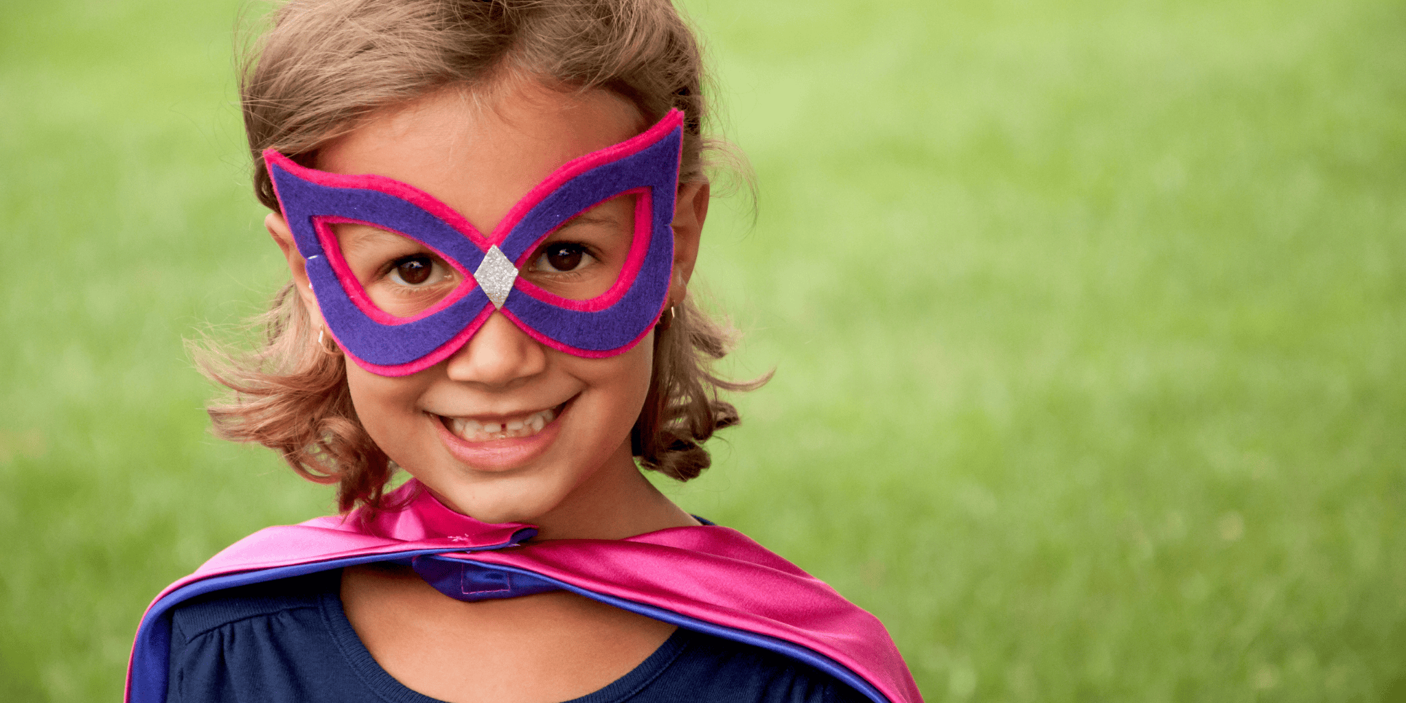 6 year old girl  wearing a superhero mask and cape handmade by a small shop in the USA - Creative Capes