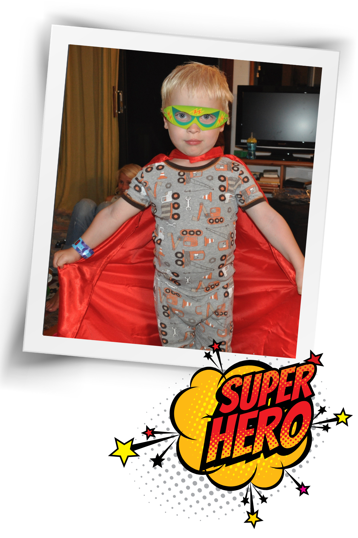 boy in red cape and tag board mask