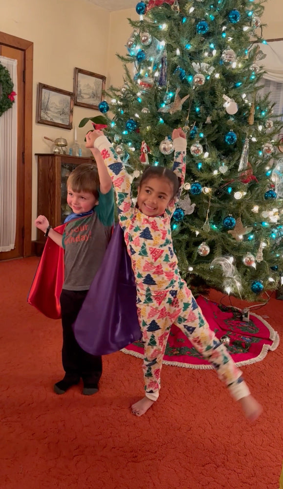 boy and girl in superhero costumes from Creative Capes
