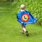 Boy playing in Personalized Superhero Cape - Blue - Creative Capes