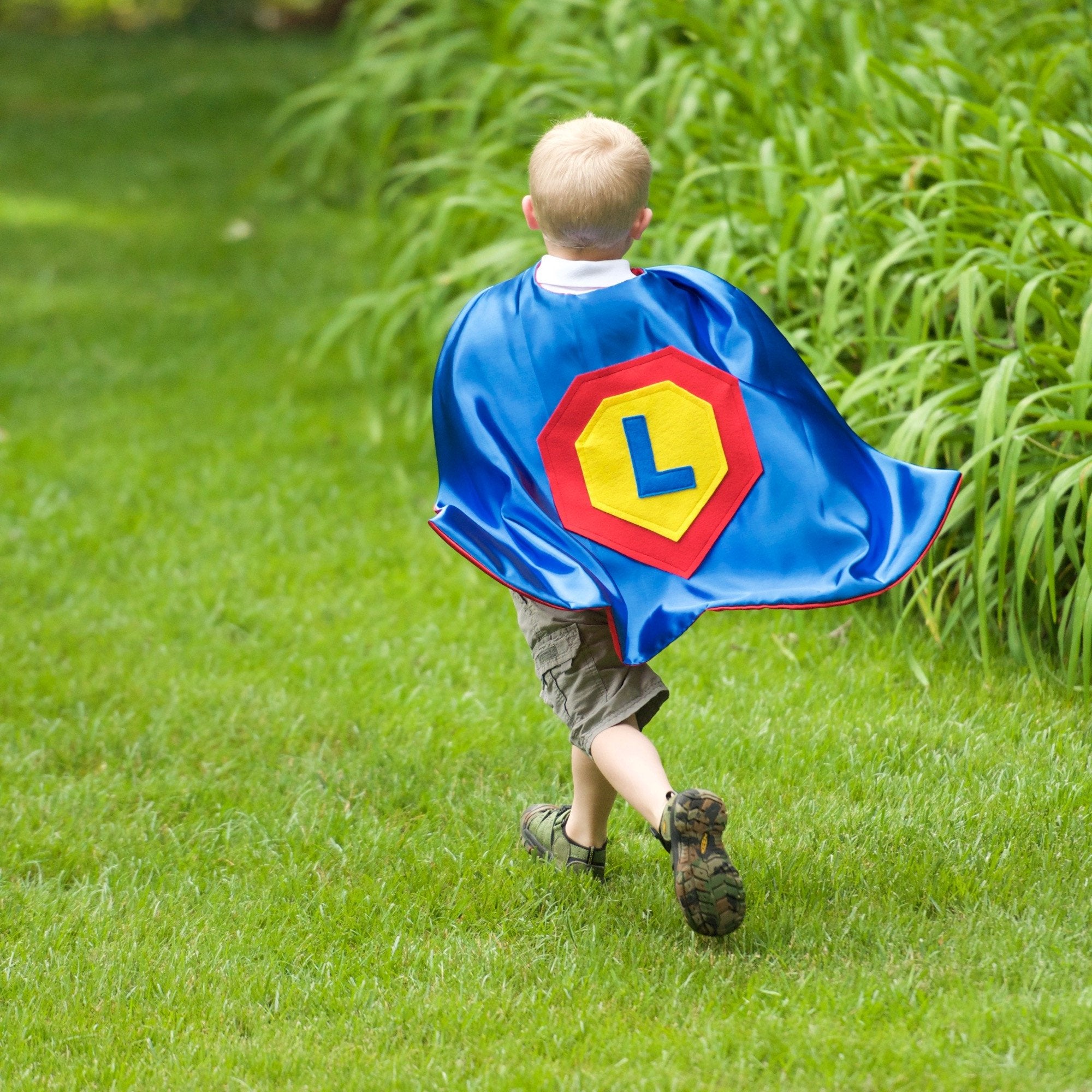 Boy playing in Personalized Superhero Cape - Blue - Creative Capes