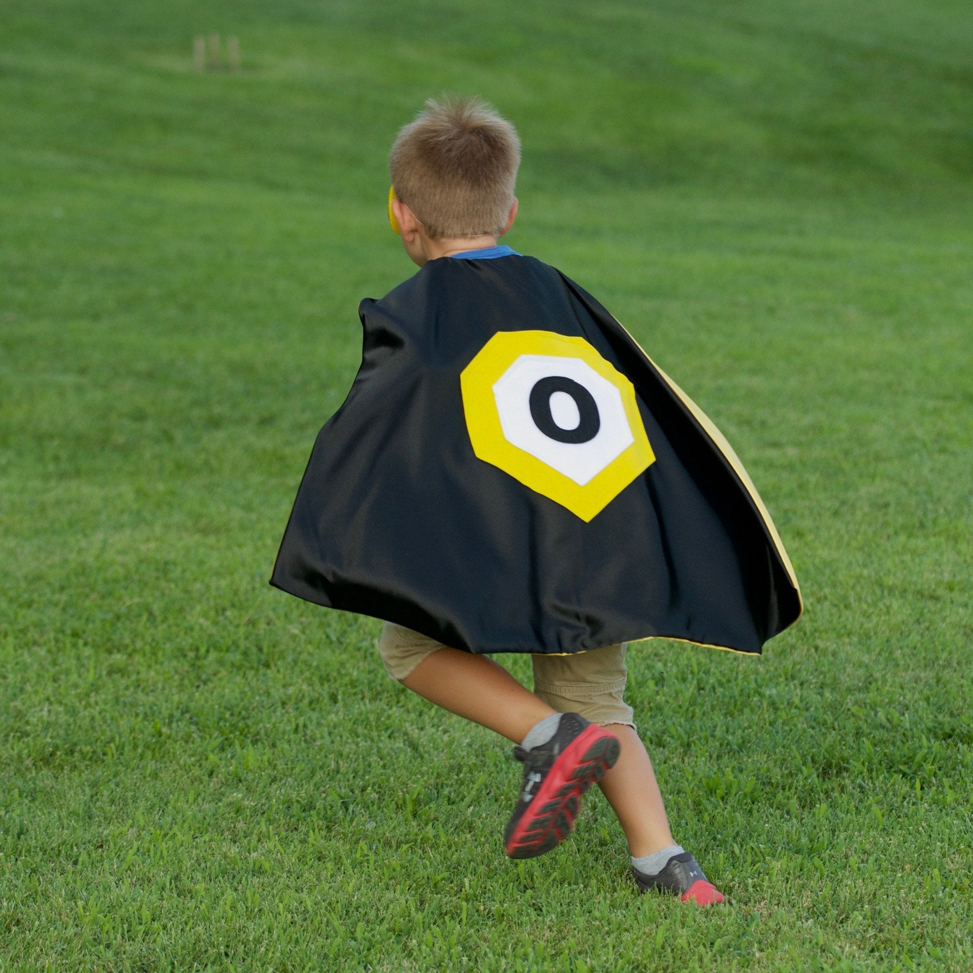 boy active in personalized black and yellow cape, Creative Capes