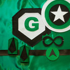 green and black personalized superhero costume set, features child's first initial on the super hero cape, dress-up costume kit includes a lined satin cape, shield, mask, belt, and wrist cuffs, handmade by Creative Capes in USA to inspire imaginative play and confidence, Play without screens creates a healthy childhood.