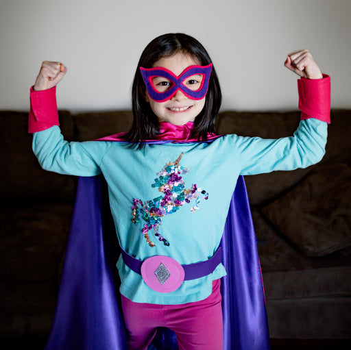 girl in purple and pink personalized superhero costume set, creative play activity, ages 3 to 8 years old, quality dress-up costume kit - satin cape, shield, mask, belt, and wrist cuffs, handmade by Creative Capes in USA, toy to inspire imaginative play and confidence, activity for imaginations, no screens for a healthy childhood