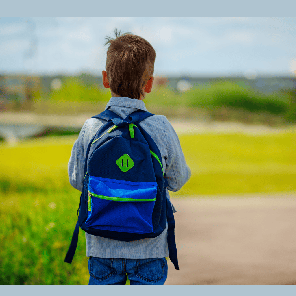 nervous kindergarten with backpack going to school