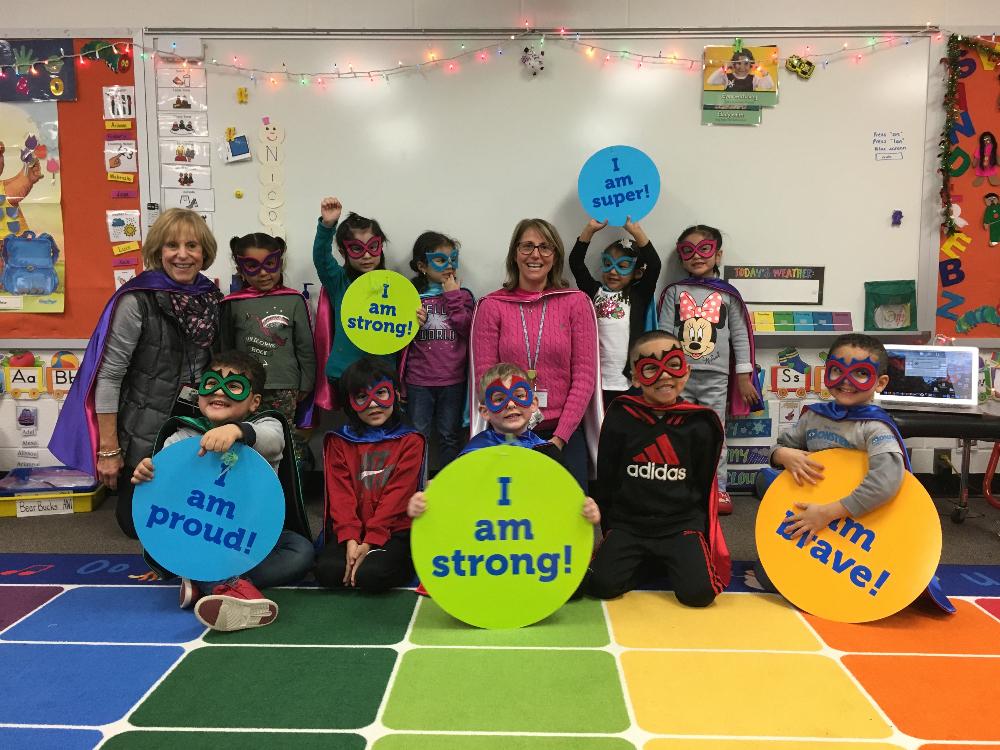 preschoolers proudly wear their super hero capes and masks from Creative Capes