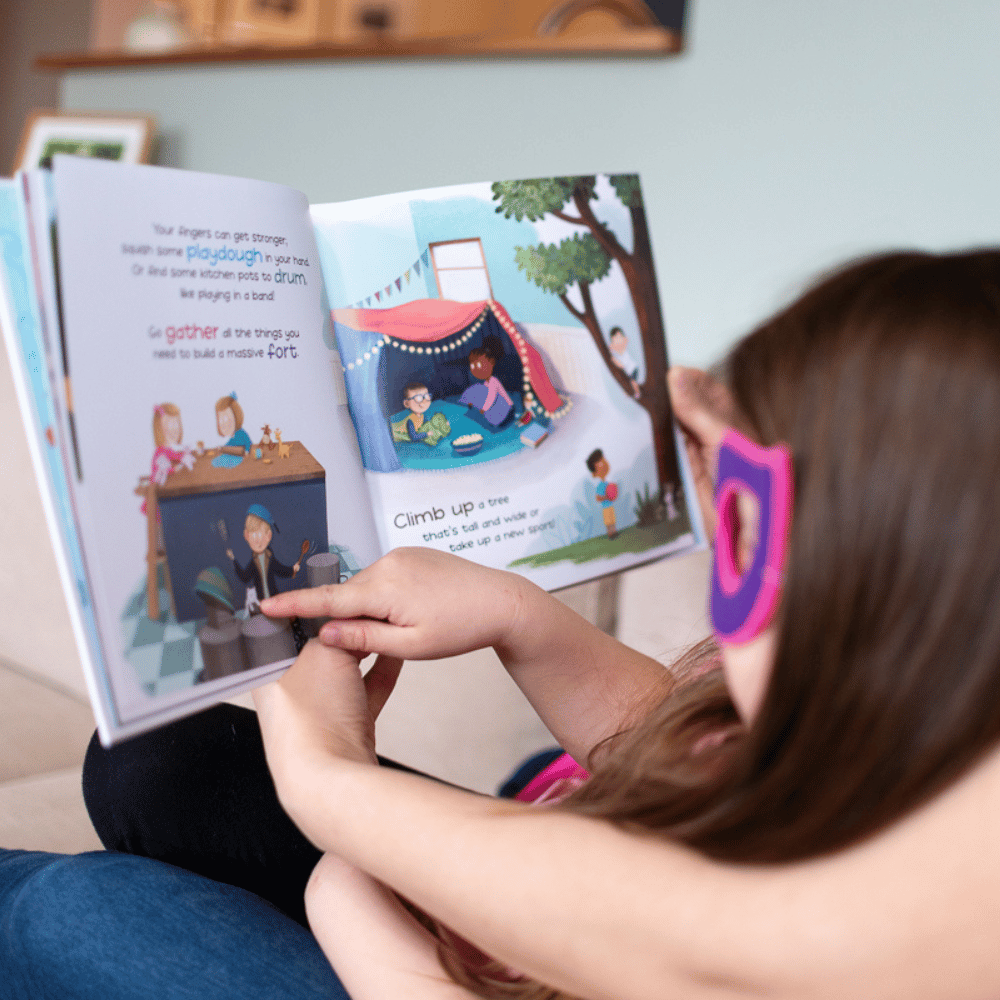 mom and child reading a children's book about the importance of screen-free play with colorful illustrations in a cozy indoor setting.