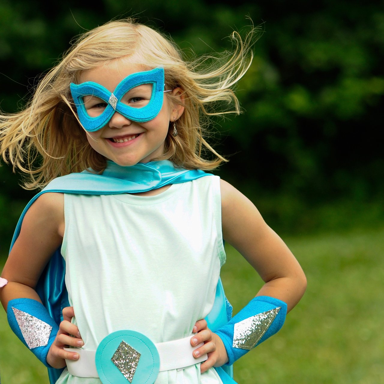 girl in handmade quality dressup costume, The aqua and silver superhero outfit is inspired by Frozen Elsa fans. Creative Capes makes quality capes and superhero costumes