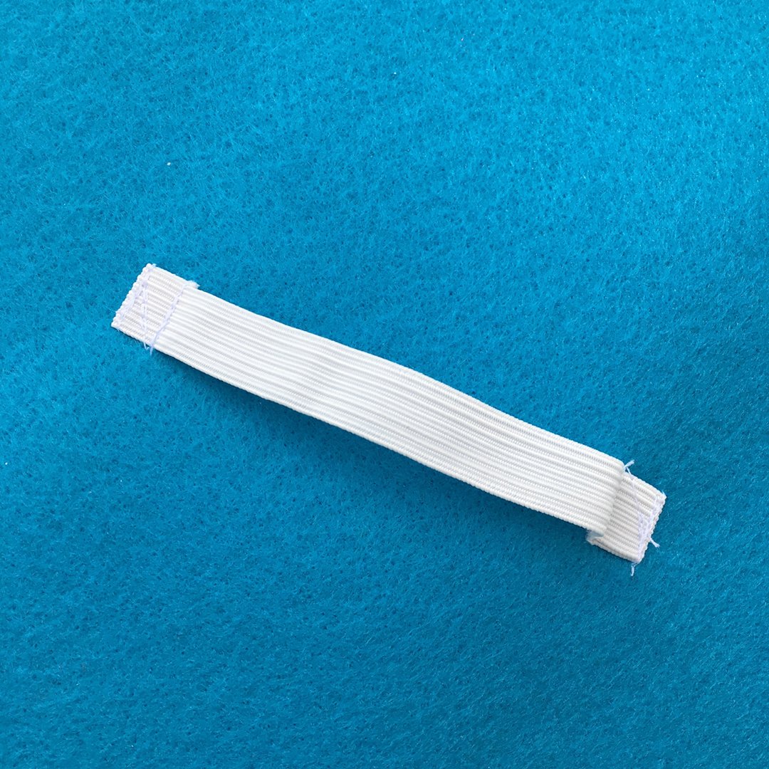 Elastic band for child's hand to hold felt shield by Creativecapes.com