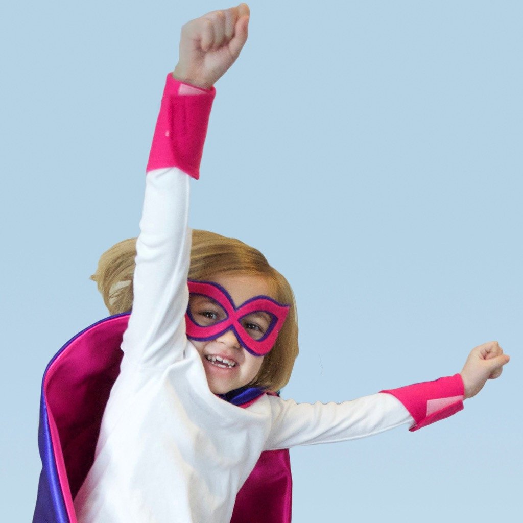 girl in purple and pink personalized superhero costume set, creative play activity, ages 3 to 8 years old, quality dress-up costume kit - satin cape, shield, mask, belt, and wrist cuffs, handmade by Creative Capes in USA, toy to inspire imaginative play and confidence, activity for imaginations, no screens for a healthy childhood